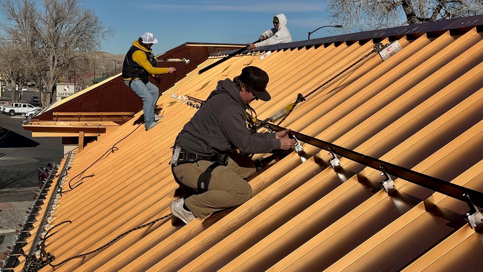 Workers with Creative Energies, a company based in Lander thats been in Wyoming since 2001, install solar panels