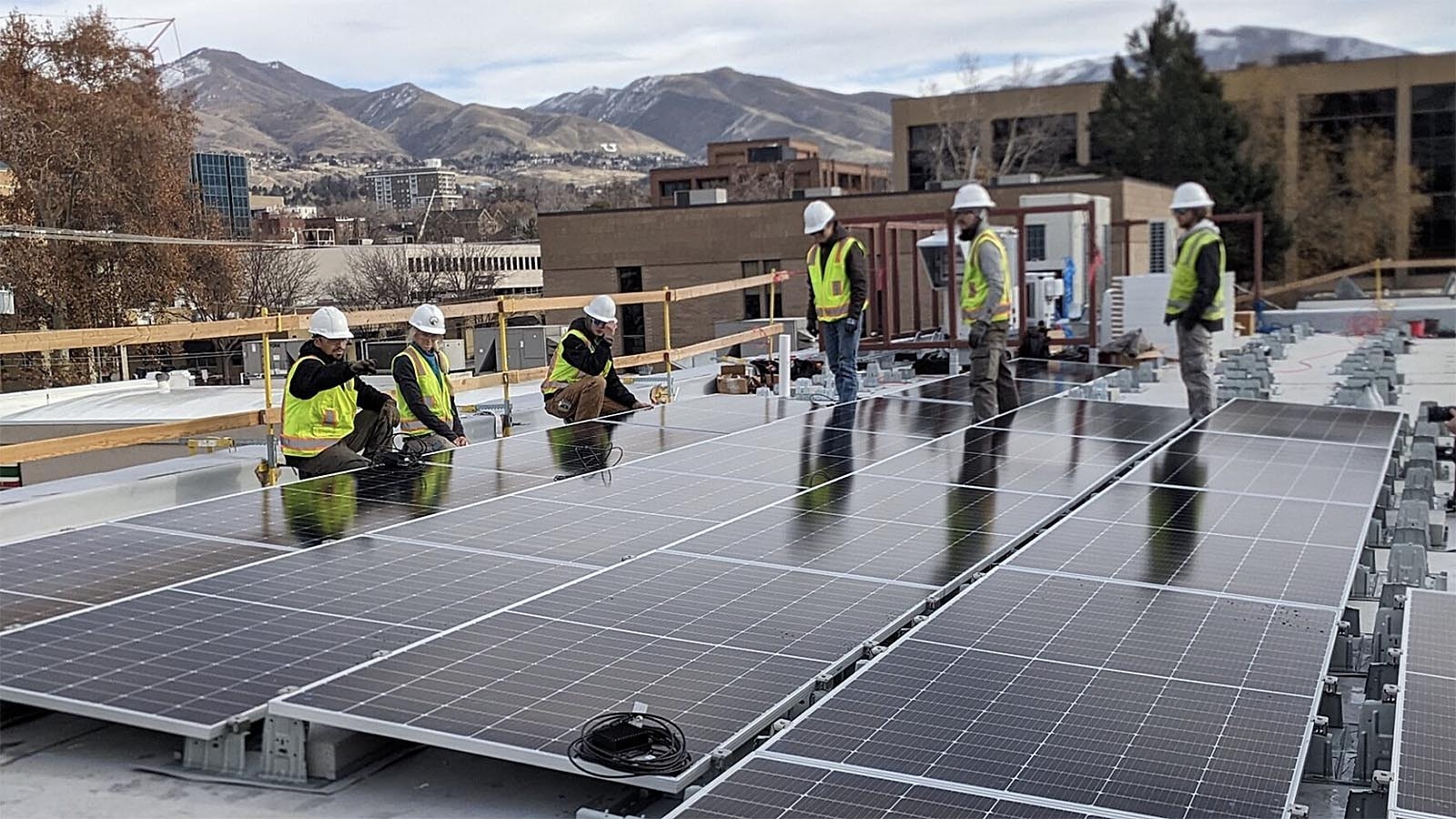 Workers with Creative Energies, a company based in Lander thats been in Wyoming since 2001, install solar panels