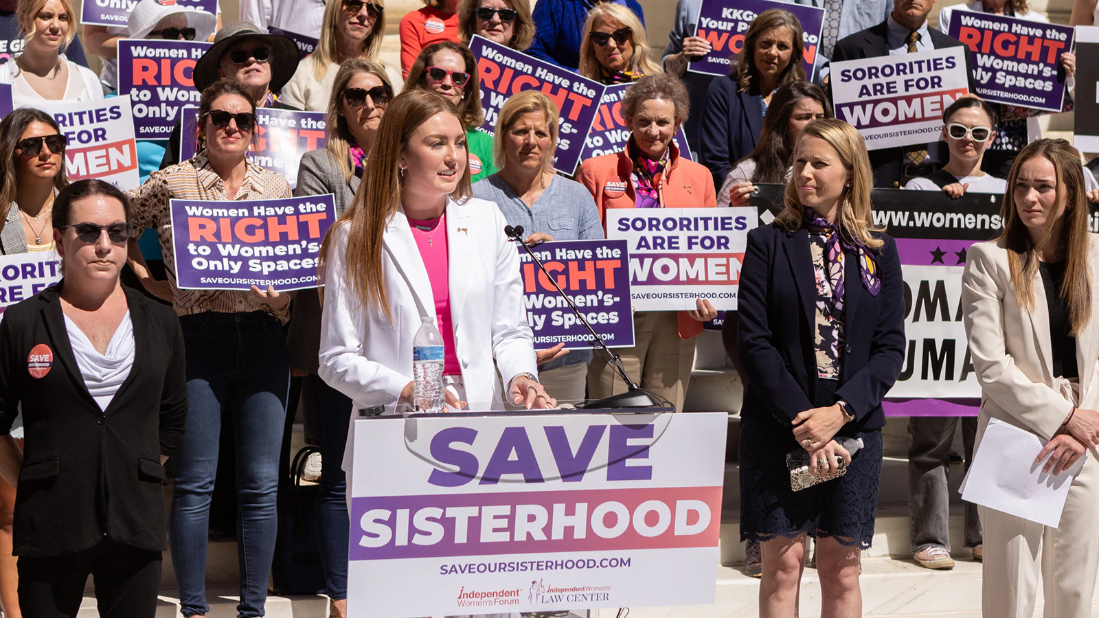 Hannah Holtmeier, one of three plaintiffs suing Kappa Kappa Gamma over its transgender membership rule, addresses a crowd at the 10th Circuit Court of Appeals.