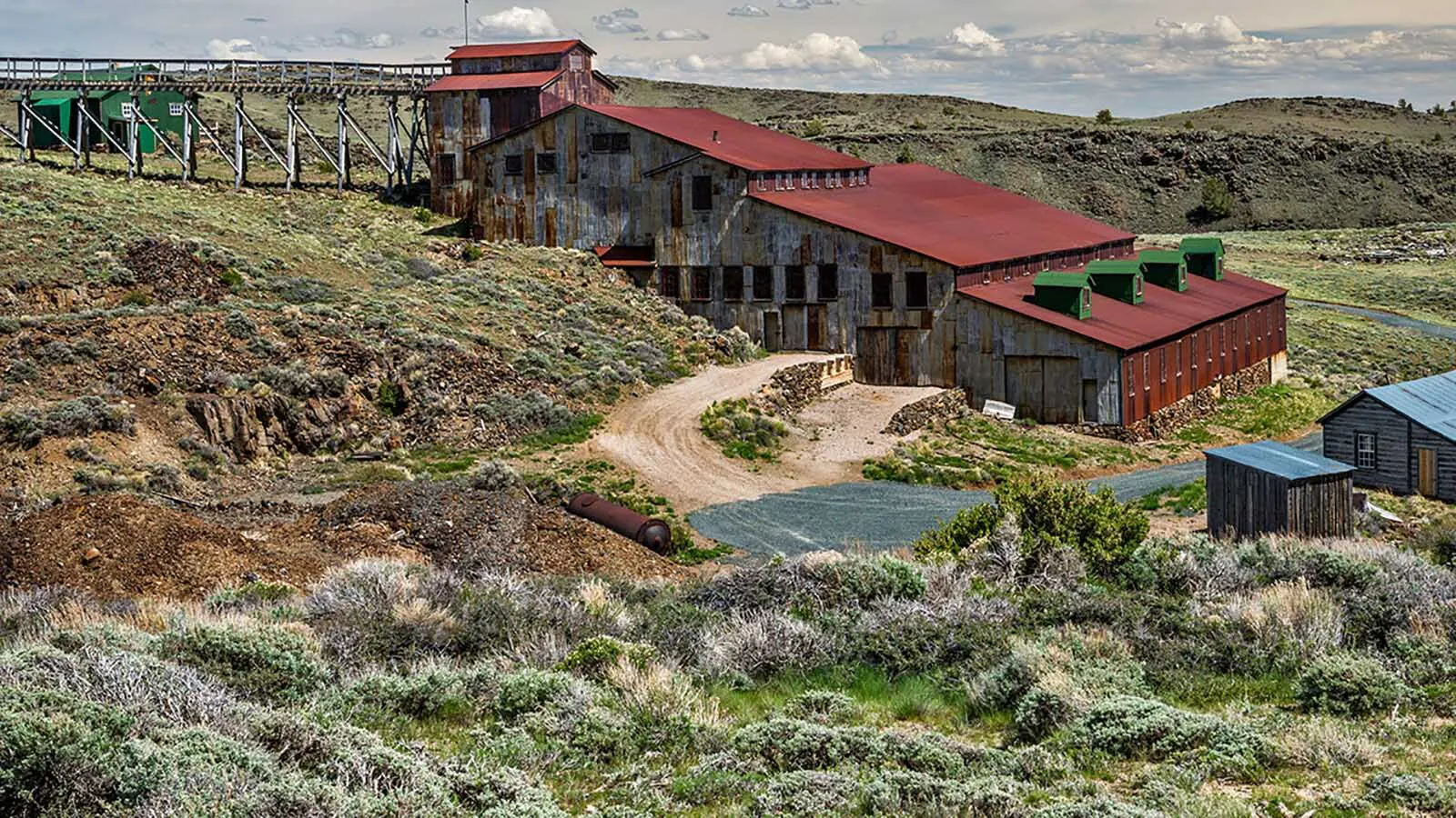 Helicopters, artificial intelligence, and geology are giving a modern mining company a second shot at finding gold in Wyoming fields that fizzled out more than a century ago. "We’re really targeting larger-scale gold,” said a company official. Above, the Carissa Mine and Mill in South Pass City.