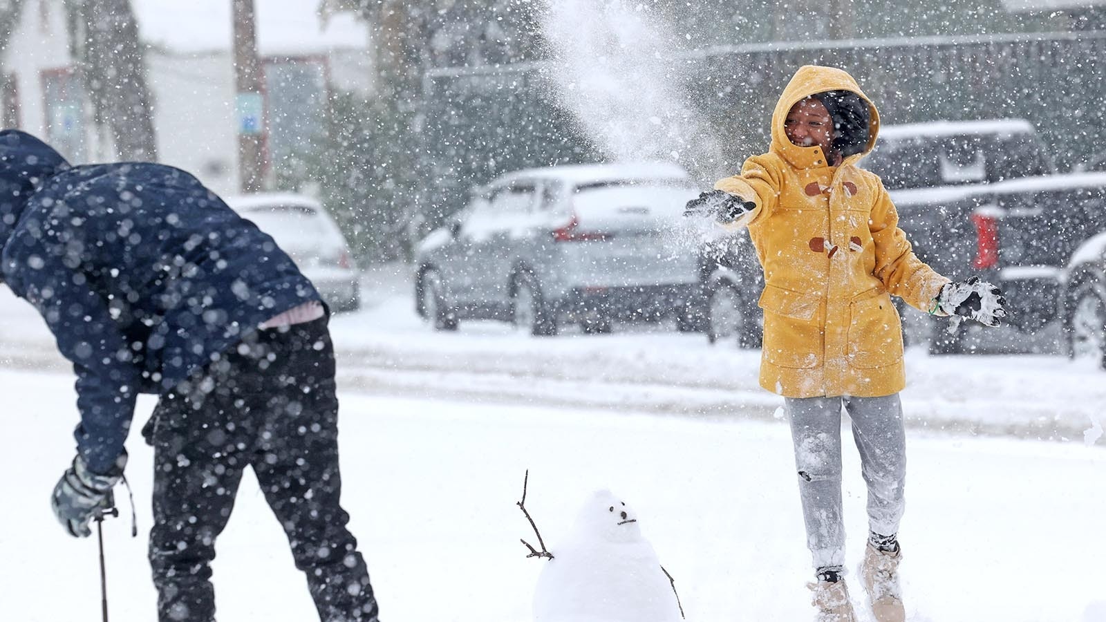 Alexiah Johnson, 9, has a snowball fight with Darrian Brown on Orleans Avenue in the Mid-City neighborhood during a snow storm Jan. 21, 2025, in New Orleans, Louisiana.