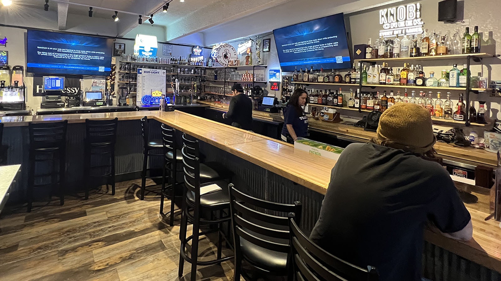 The TVs at Ike's Bar and Grill in Cheyenne are tuned to ESPN, which isn't showing its regular sports content because of a dispute with Disney.
