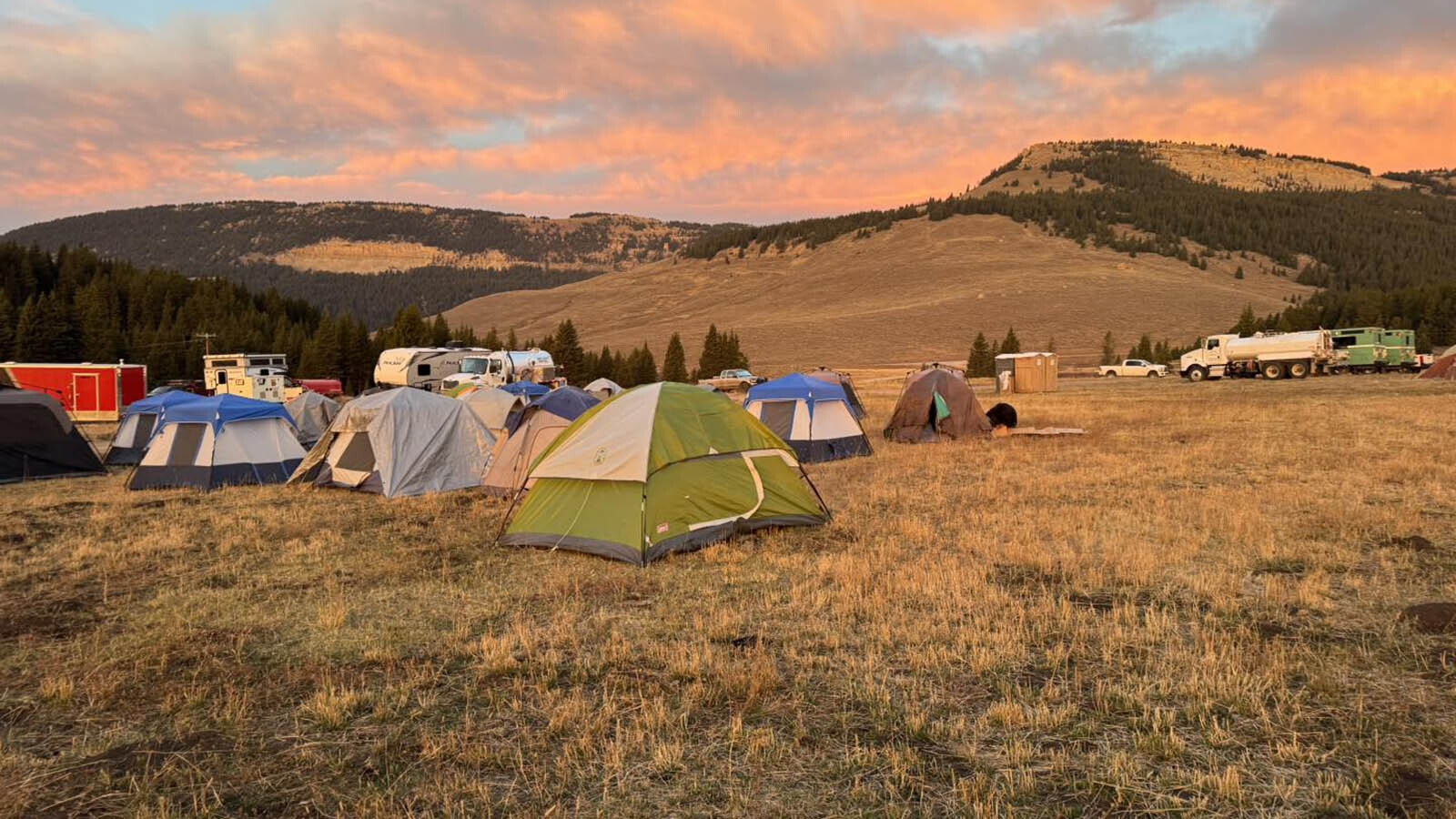 More sleeping tents arranged on the perimeter.