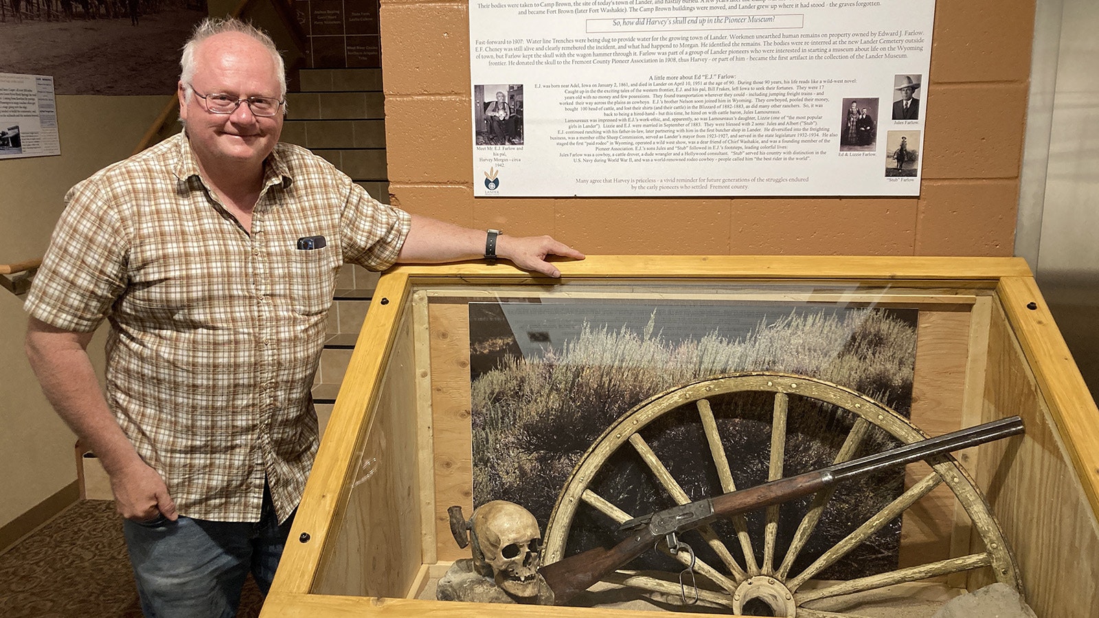 Randy Wise, curator of Lander’s Pioneer Museum, with the skull of Harvey Morgan, which still has the spike hammer that killed him embedded through his skull.