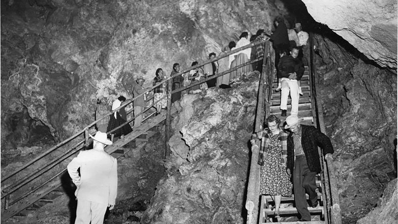 Crowds of people are led through Spirit Caverns after its celebrated opening in 1957.