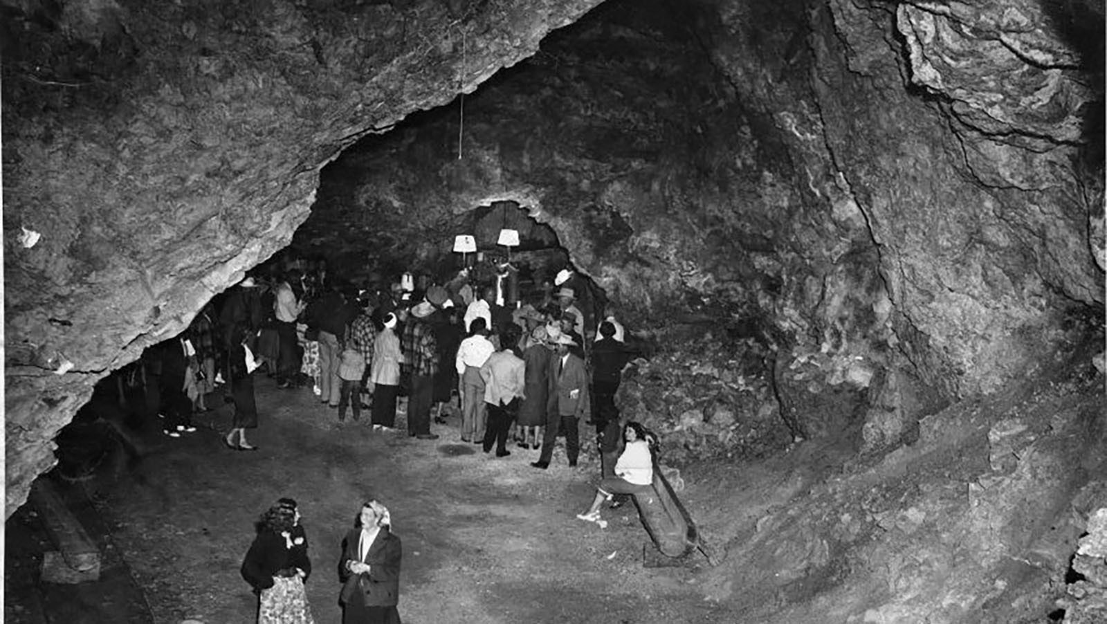 Crowds of people are led through Spirit Caverns after its celebrated opening in 1957.