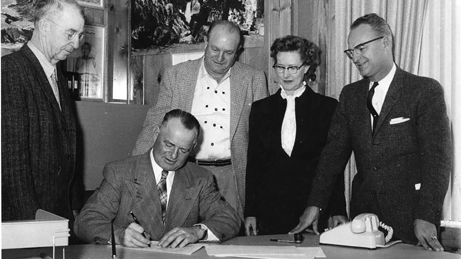 Signing the contract with Heron Engineering to build an aerial tramway at Spirit Mountain Caverns on Nov. 17, 1959, are, from left, Cody Mayor High Smith, Claud Brown, Henry Hecht, Katie Brown and Mike M. Vukelich.