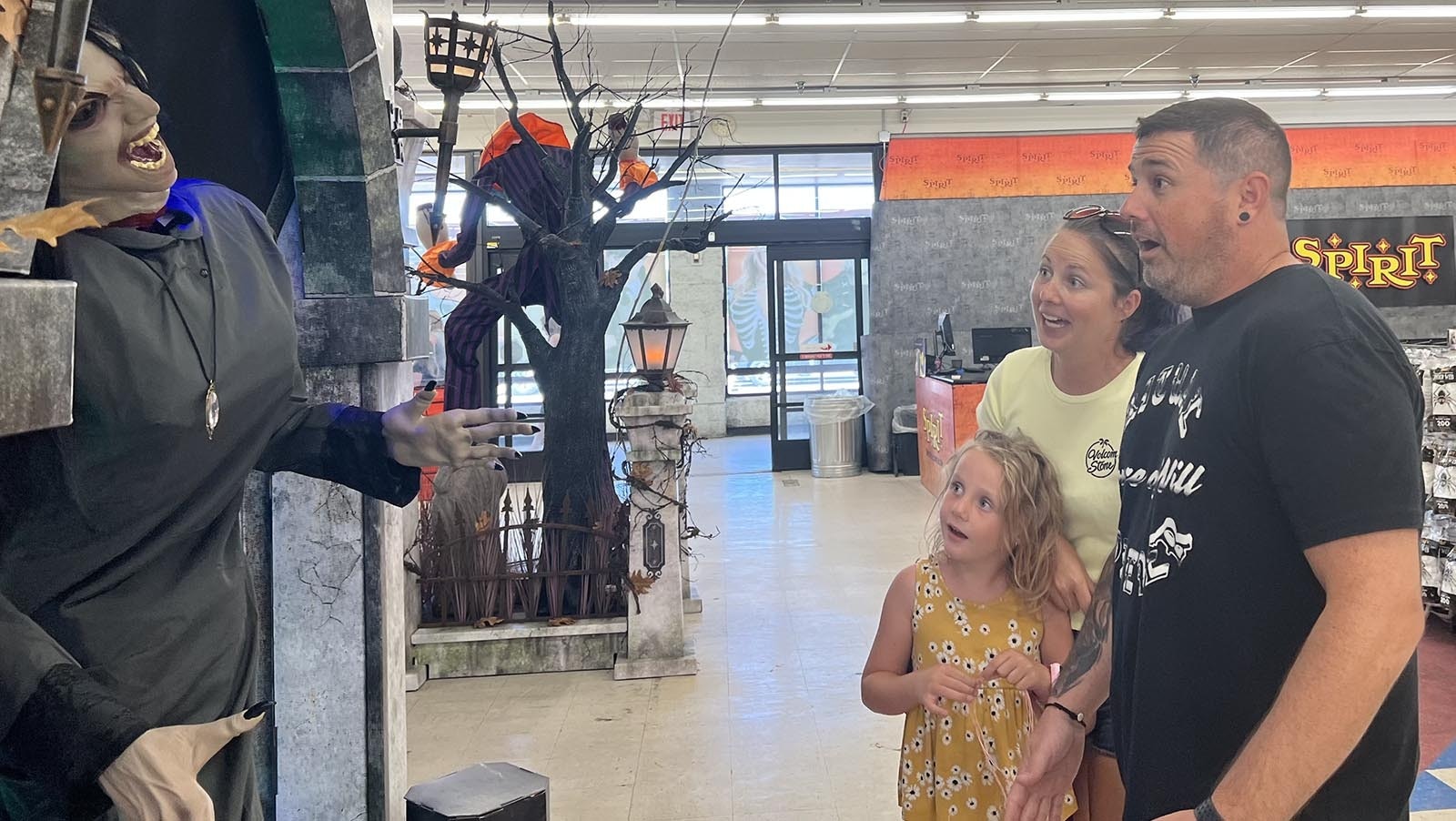 Ryan King, his sister Codi King and her daughter, Madison, react to a spooky animatronic at the Spirit Halloween Store in Cheyenne Thursday.