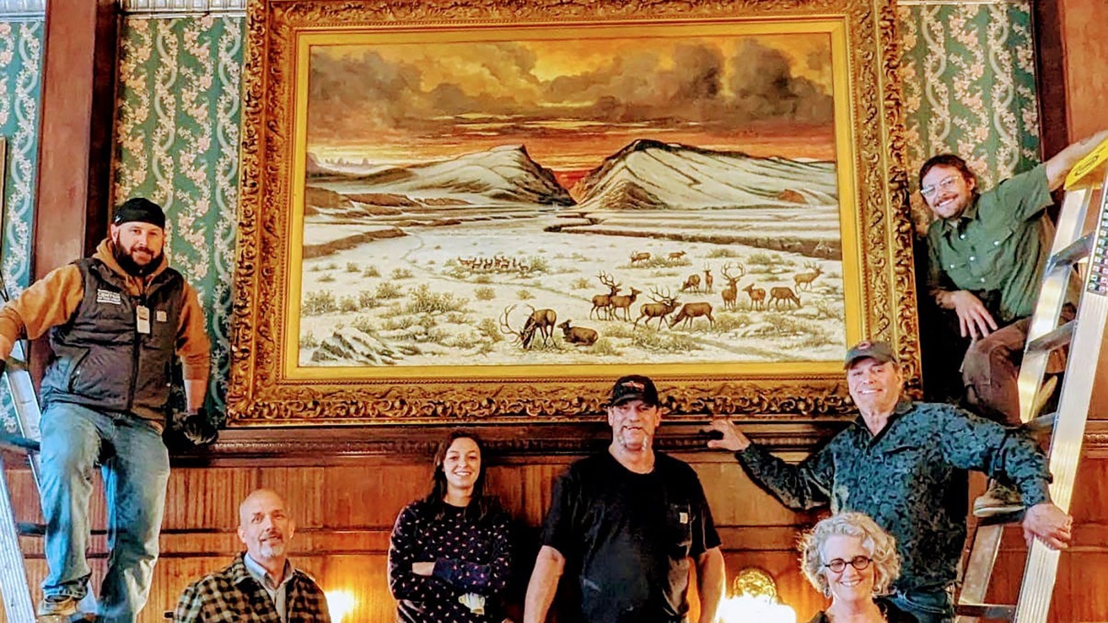 After decades away, "Shoshone Canyon" hangs again at Cody's iconic Irma Hotel. The large painting was cleaed with human spit to remove decades of grime and restore it to its historic glory.