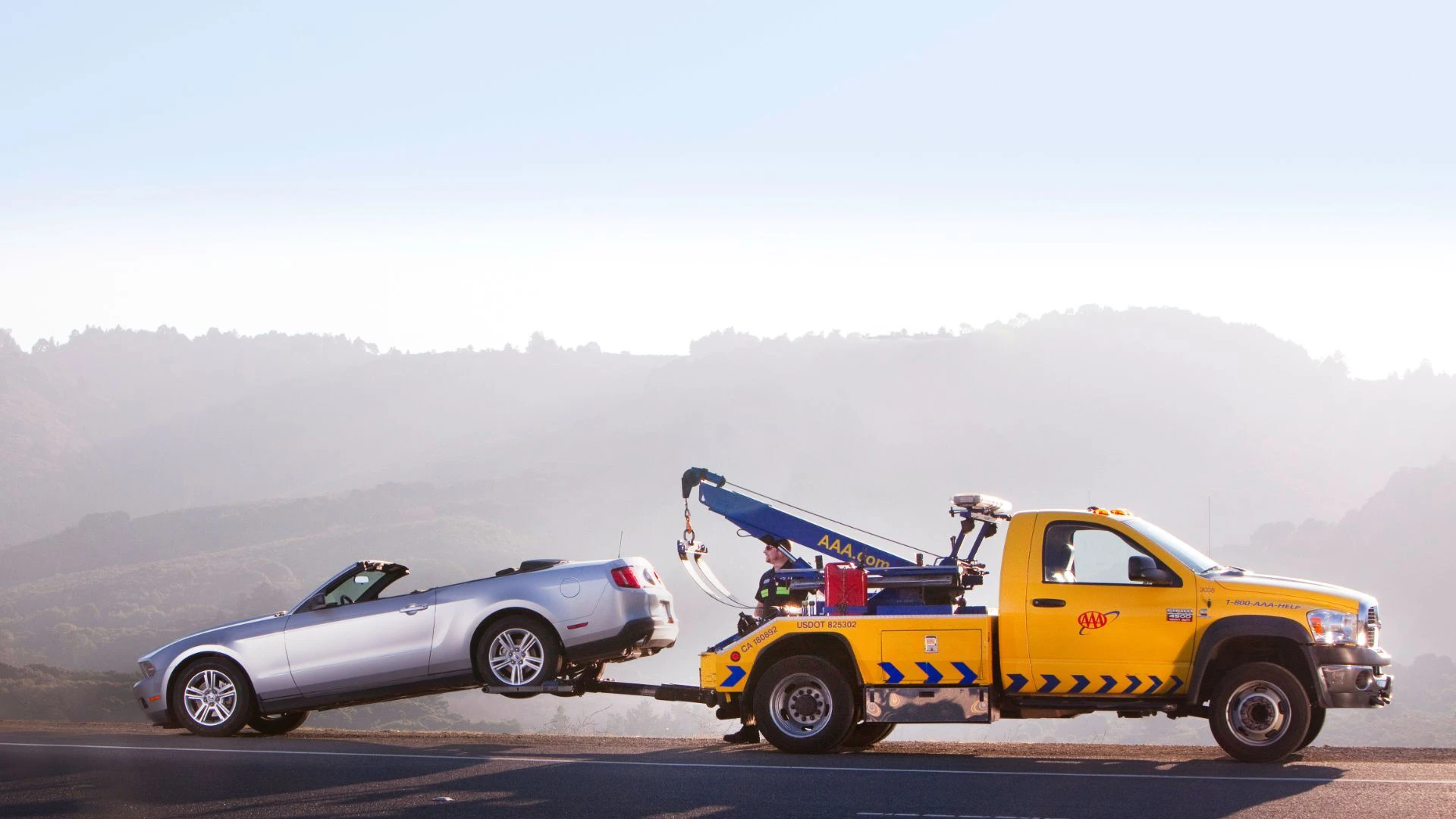 Image of Car being towed.