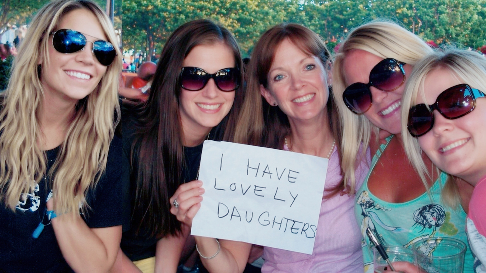 Mom with daughters holding a sign that reads: I have lovely daughters