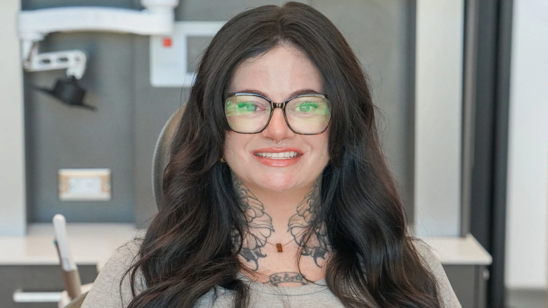 Legacy Institute Dental's patient Halley O'Donnell smiles to camera after a successful dental implant procedure. 