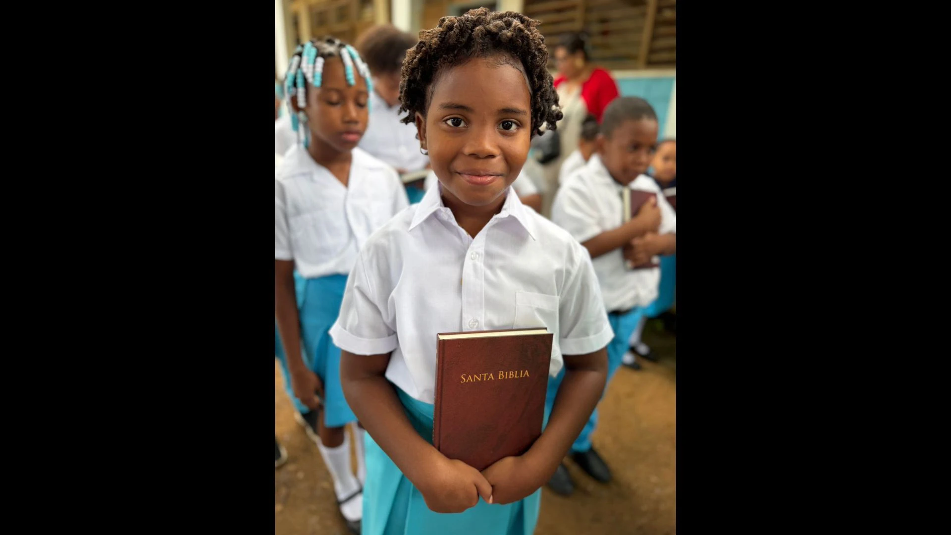 Students are happy to receive their first Bible.