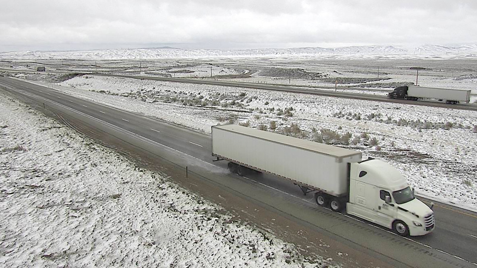 Interstate 80 eastbound in southwest Wyoming west of Rawlins on Monday morning was goomy, cold, wet and snowy.