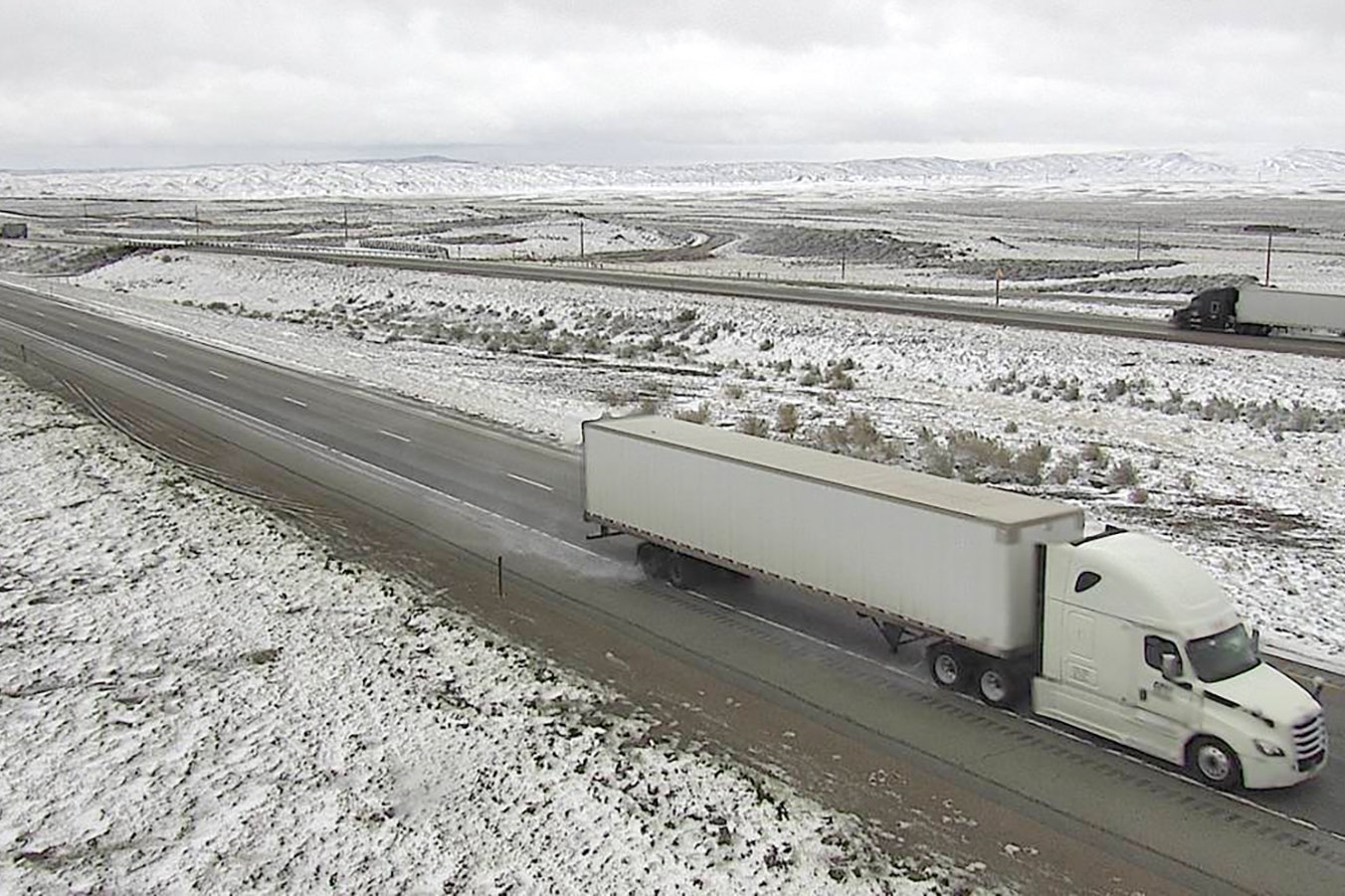 Interstate 80 eastbound in southwest Wyoming west of Rawlins on Monday morning was goomy, cold, wet and snowy.