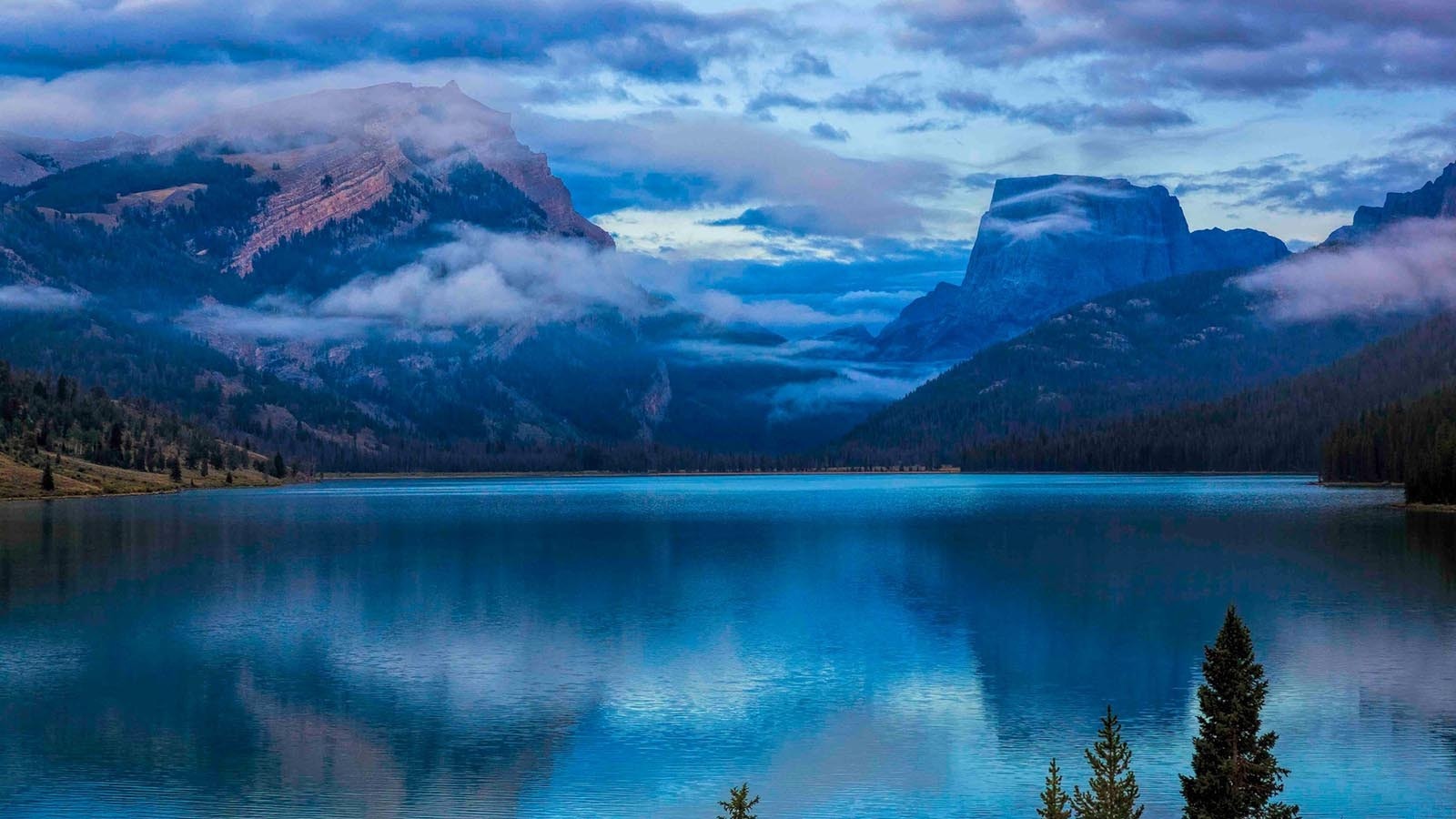 The view looking down the Green River to Squaretop Mountain in western Wyoming is one of the state’s most recognizable landmarks, even being on the license plate. Now the Dollar Lake Fire is threatening to change that.