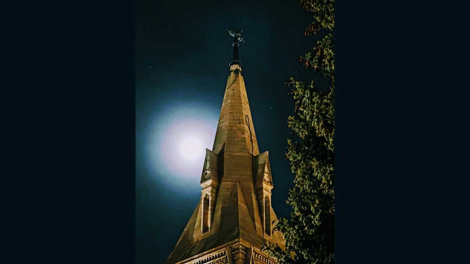 St. Matthew's spire with the moon behind it.