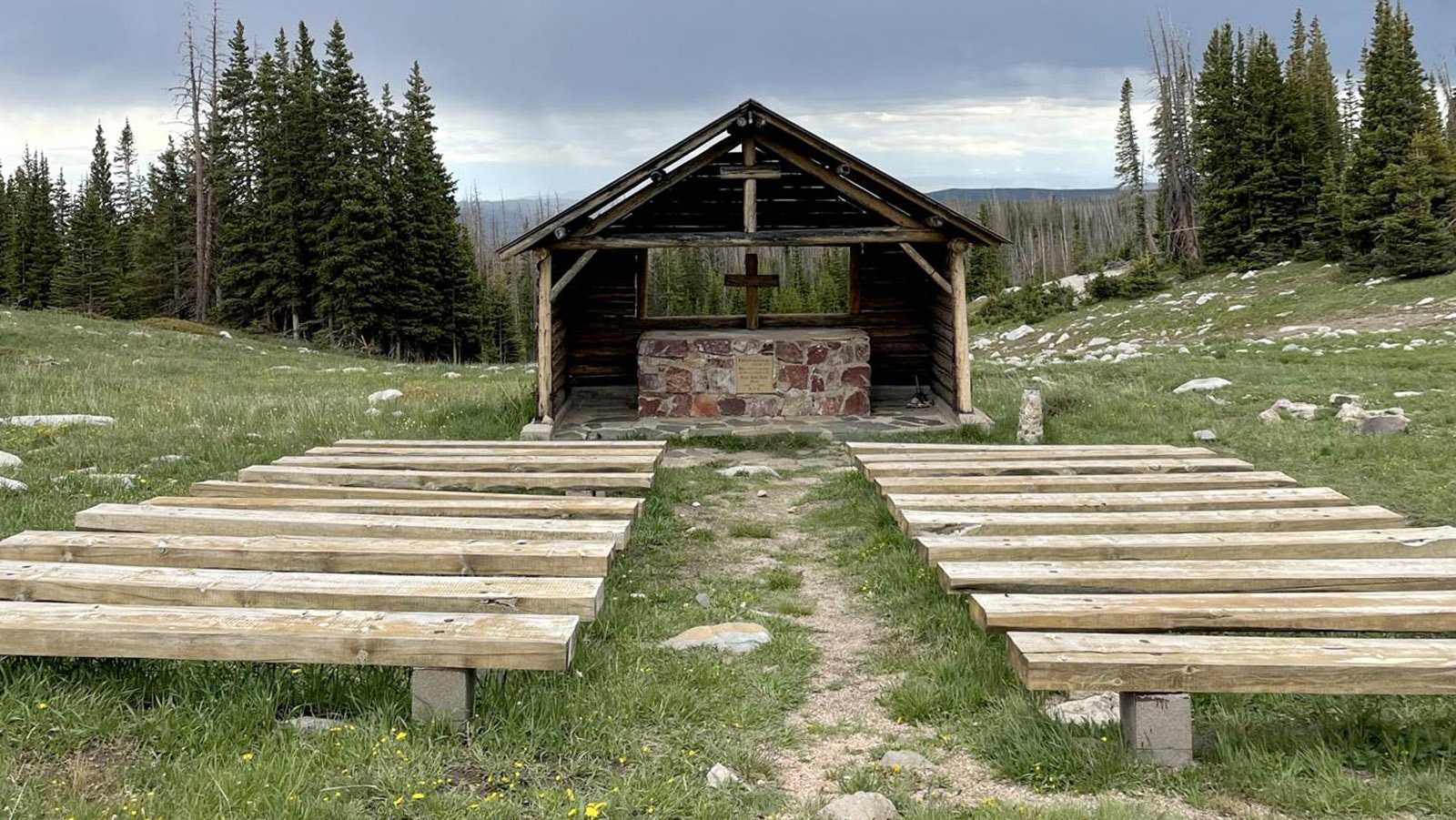 St. Alban's Chapel sits on a hill with a vast view of the Snowies and Centennial Valley.