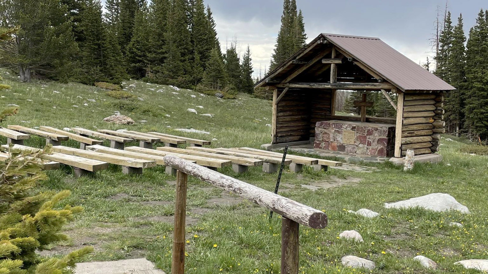 St. Alban's Chapel sits on a hill with a vast view of the Snowies and Centennial Valley.