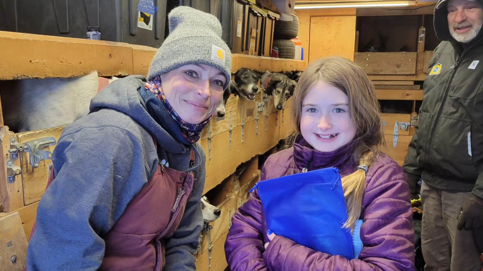 Wisconsin musher Sarah Tarlton introduces her dogs to her 10-year-old junior musher.