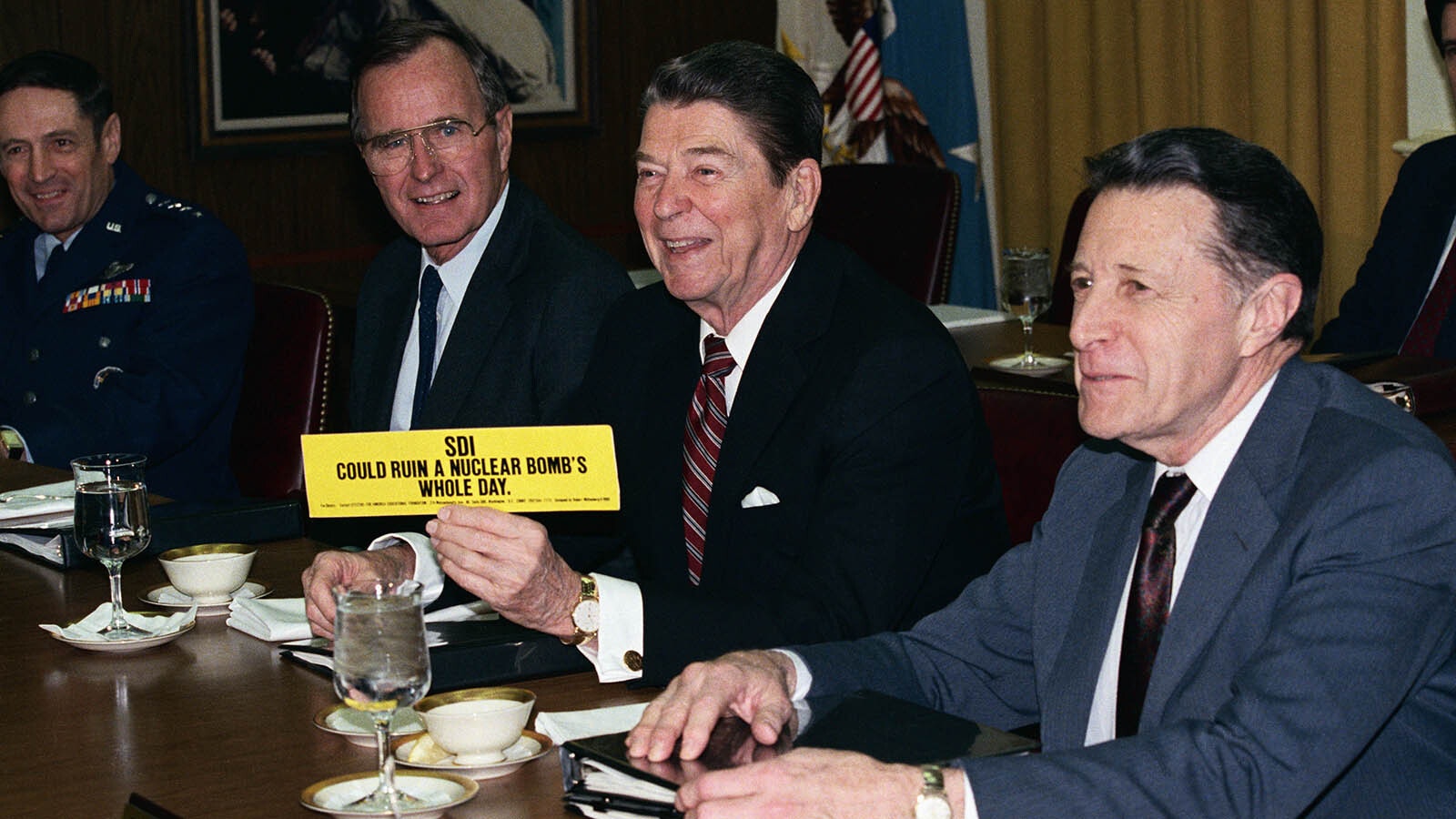 President Ronald Reagan shows support for the Strategic Defense Initiative nicknamed Star Wars. The bumper sticker reads "SDI could ruin a nuclear bombs whole day."