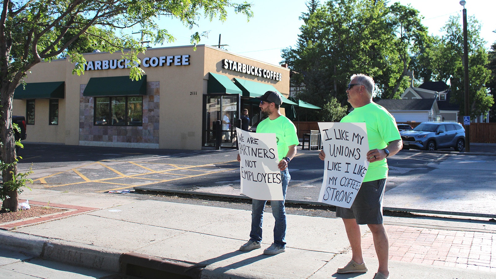Austin Vye, a member of the International Brotherhood of Electrical Workers Local 415, and his father, Mark, supported Sunday's Starbucks strike.