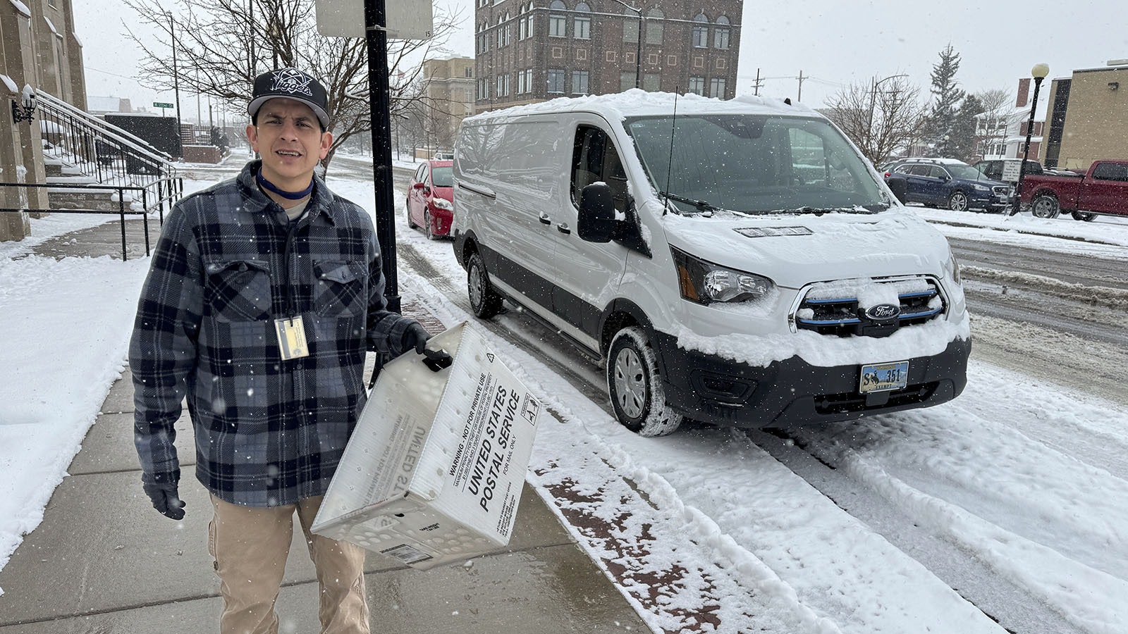 Danny Barela moves mail with one of Wyoming’s two electric-powered cargo vans.