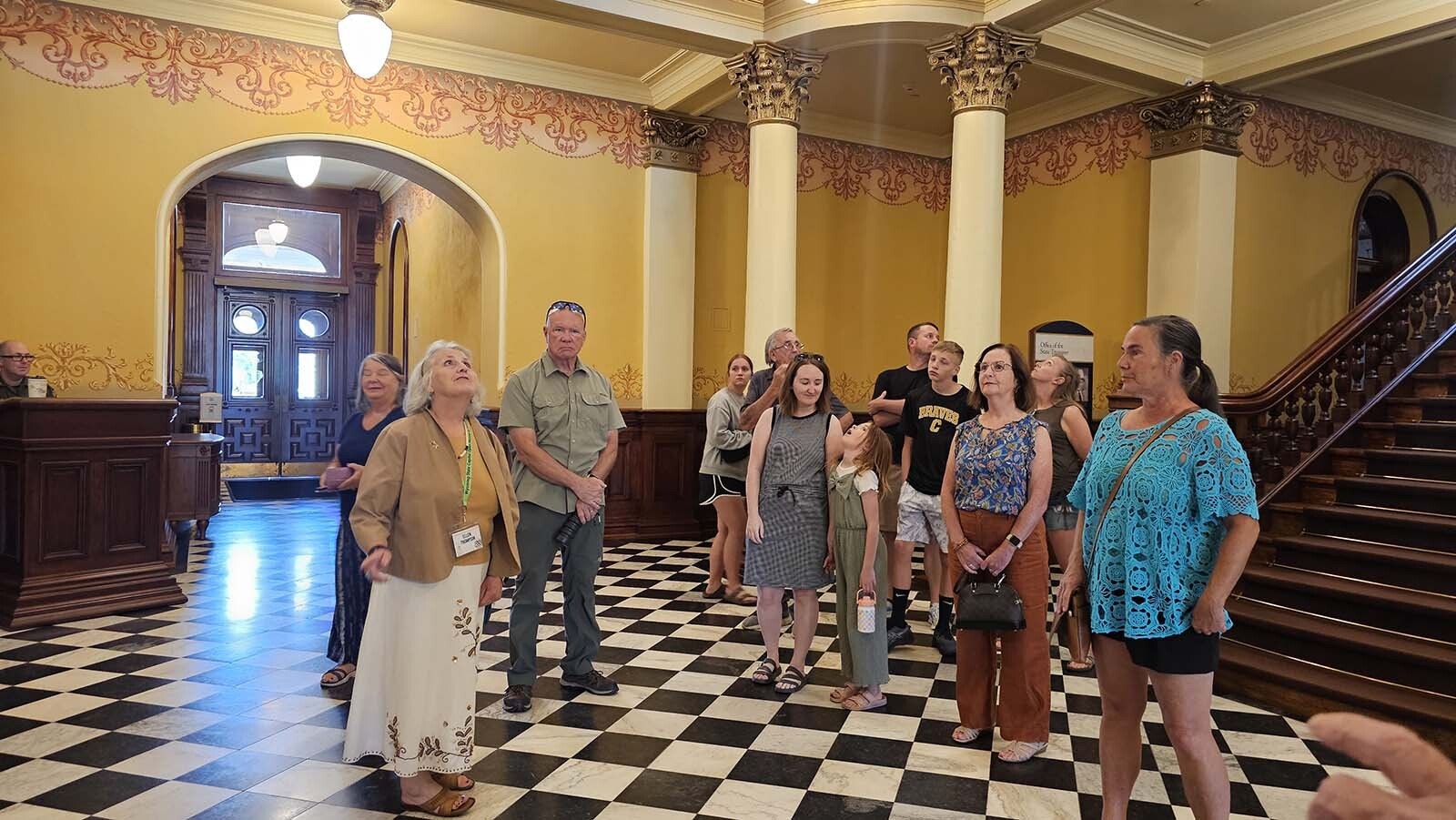 Ellen Thompson leads a tour group through the Wyoming Capitol on July 10, 2025, Statehood Day in celebration of Wyoming's 135th anniversary of statehood.