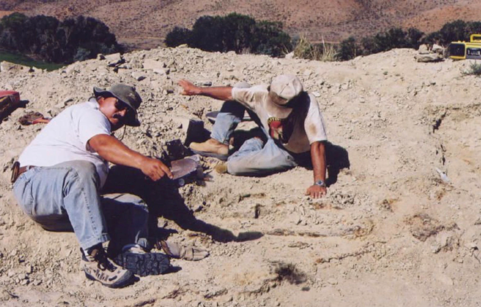 Bob Simon and Robert Boscarelli excavating the fossilized bones of a Stegosaurus, "Sophie," near Shell in 2004. The Late Jurassic dinosaur skeleton, which is 85% complete, is considered the most complete and best-preserved Stegosaurus specimen ever found.