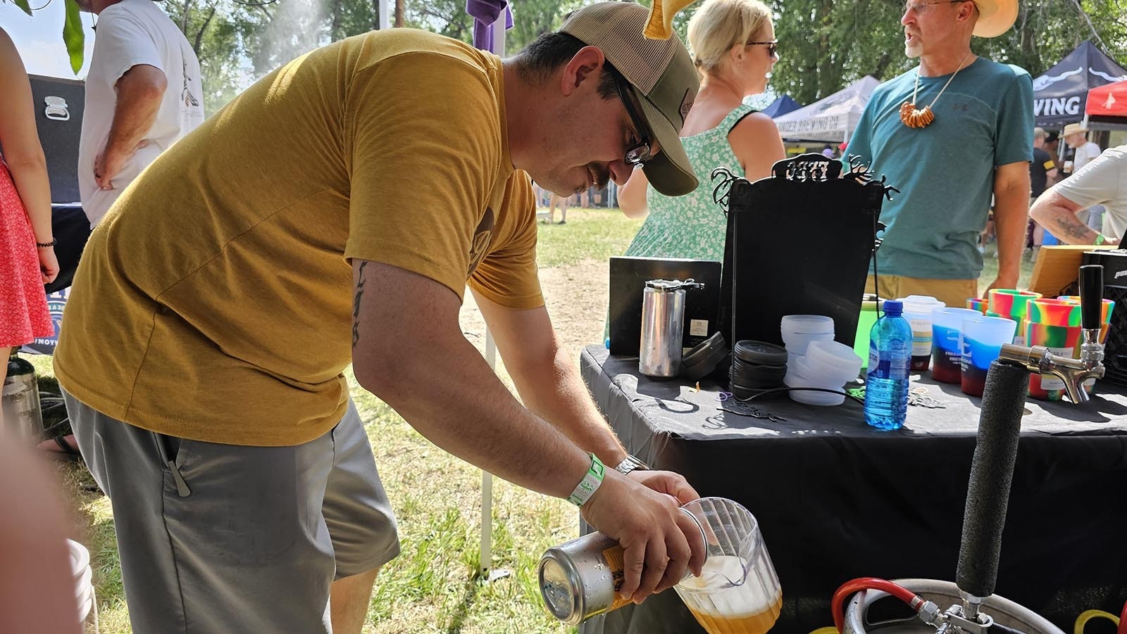 Eric Kilmer with Freedom's Edge pours some of his pilsner into a pitcher for judges at the Steinley Cup in Saratoga.