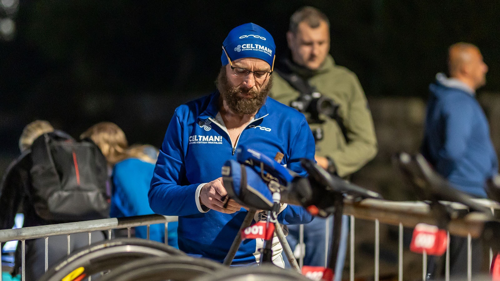 Steve Bang preparing his bike in transition before being transported by boat to Mamula Island for the X-Out Extreme Triathlon start.