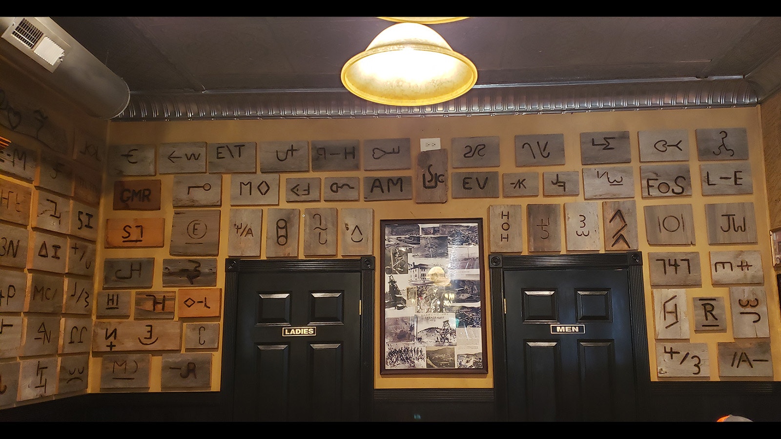 Brands from area ranchers decorate the back wall at Miners and Stockmen's Steakhouse and Spirits.