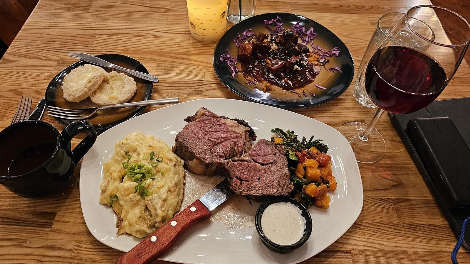 A prime rib dinner at Stockman's Saloon and Steakhouse, with a glass of red wine.