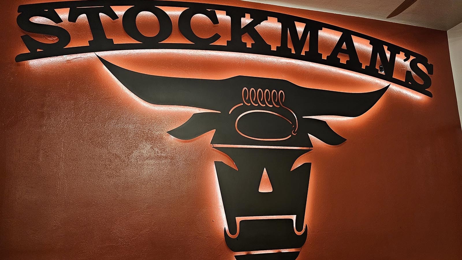 The logo for Stockman's Saloon and Steakhouse decorates an entire wall at Stockman's Saloon and Steakhouse.