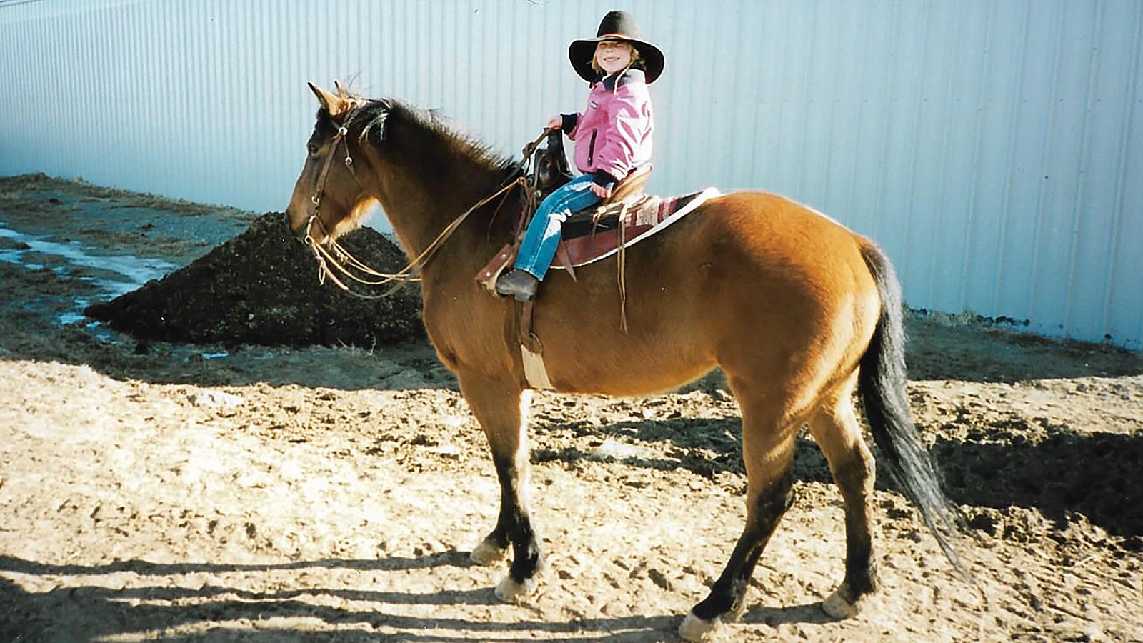 Cathy and Von Ringler raised their daughters on horseback where Cathy would tell her girls stories to keep them entertained. Her daughter, Ashley, is riding the family horse, Cheyenne.