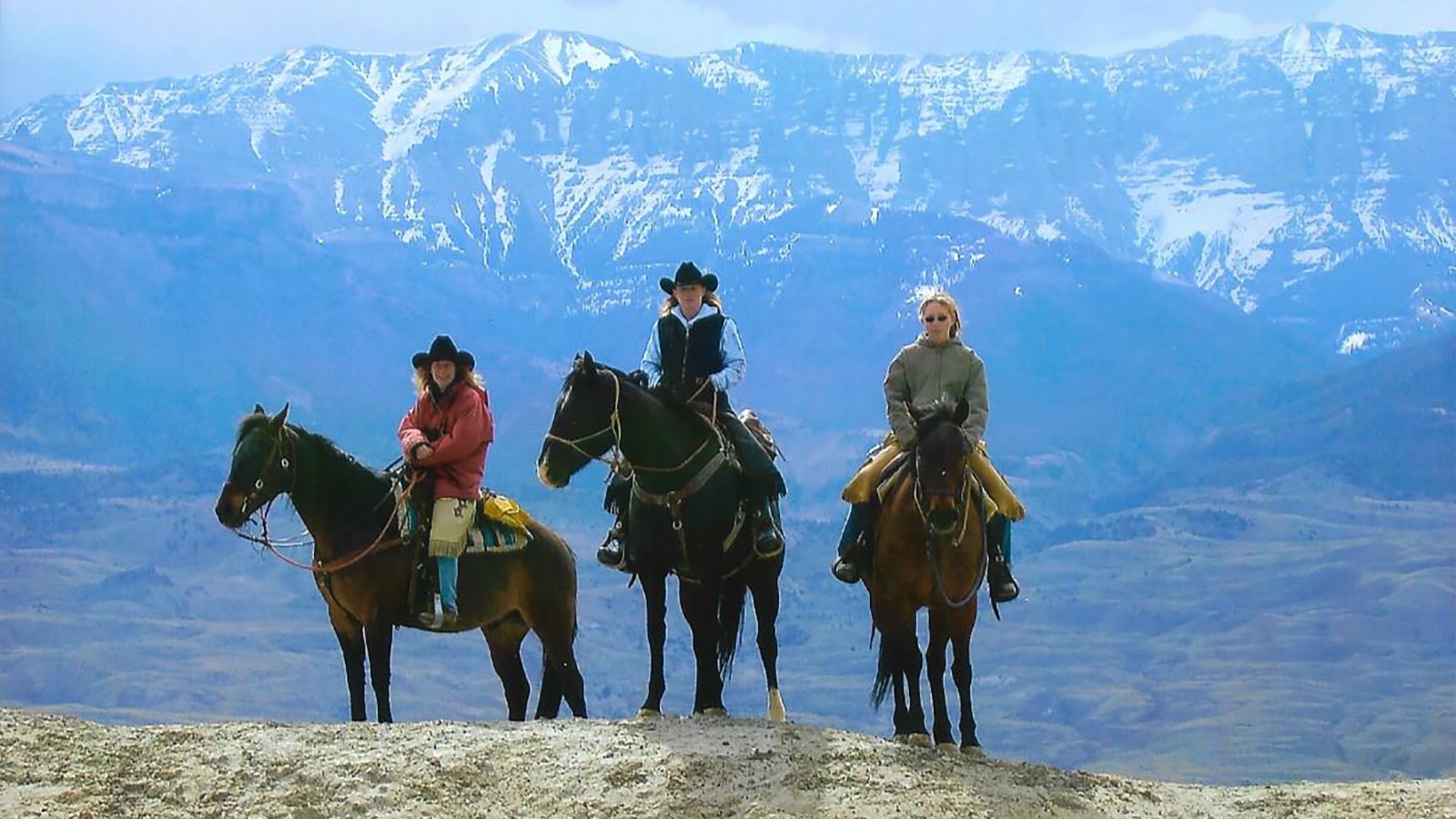 Cathy Ringler, left, with her two daughter on South Fork. During these horse trips, her daughters would beg her to tell them stories as they rode along.