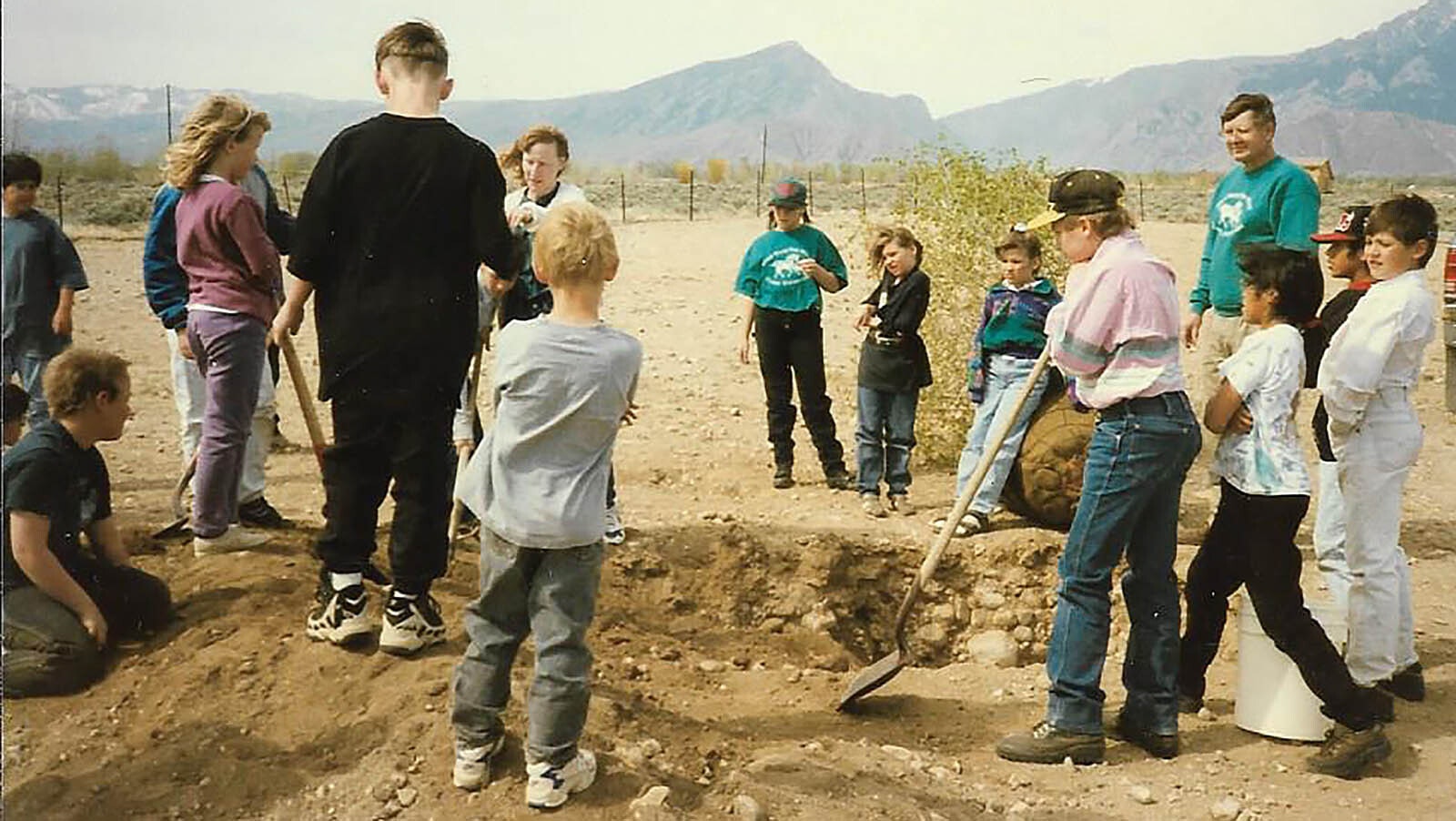 “We had no trees or grass on our playground,” Cathy Ringler said. The district finally agreed to plant grass, and the parents and students got together to plant a tree belt.