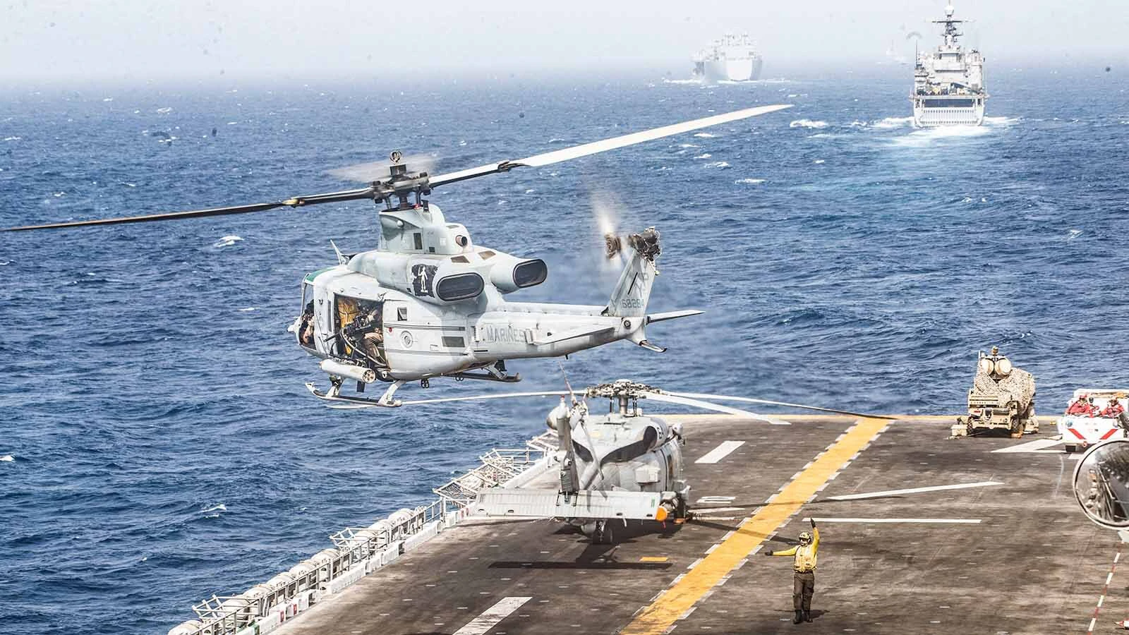 A Navy helicopter takes off from a the deck of the Boxer, a U.S. amphibious assault ship, in the Strait of Hormuz on July 18, 2019.