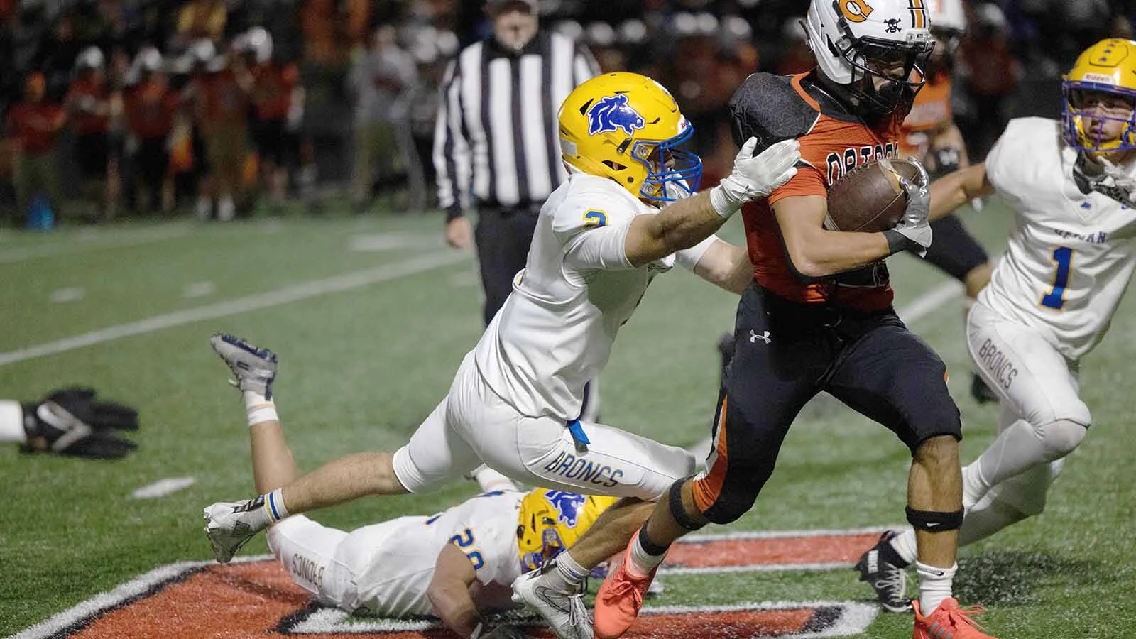 A Bronc attempts to bring down a Natrona player on Friday night.