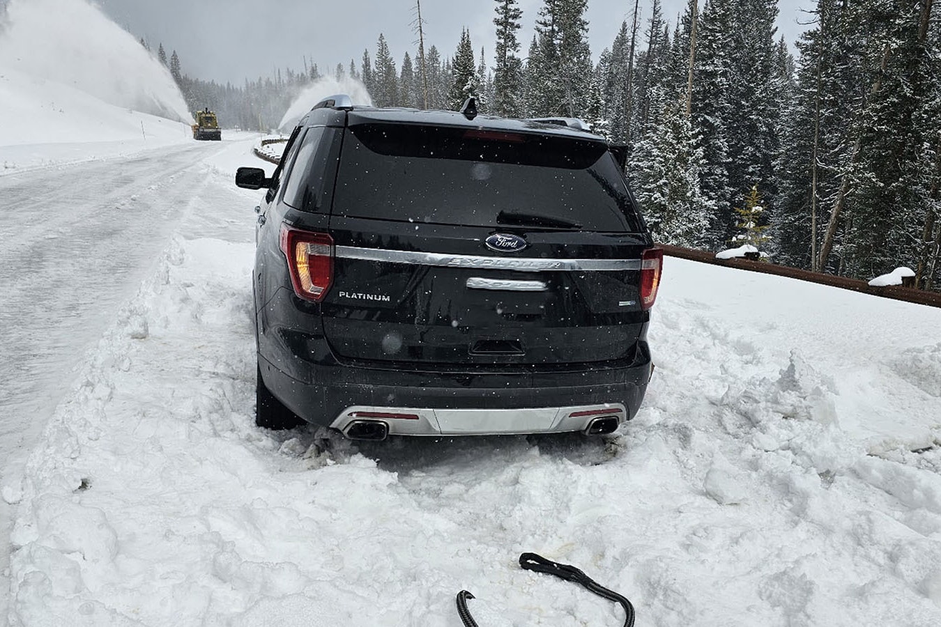 This two-wheel-drive Ford Explorer was stuck for about 10 hours on a snowpacked Highway 212 near Yellowstone overnight Wednesday. The road is still closed for the season, but the driver of the vehicle — visitors to the area — said Google sent them there.