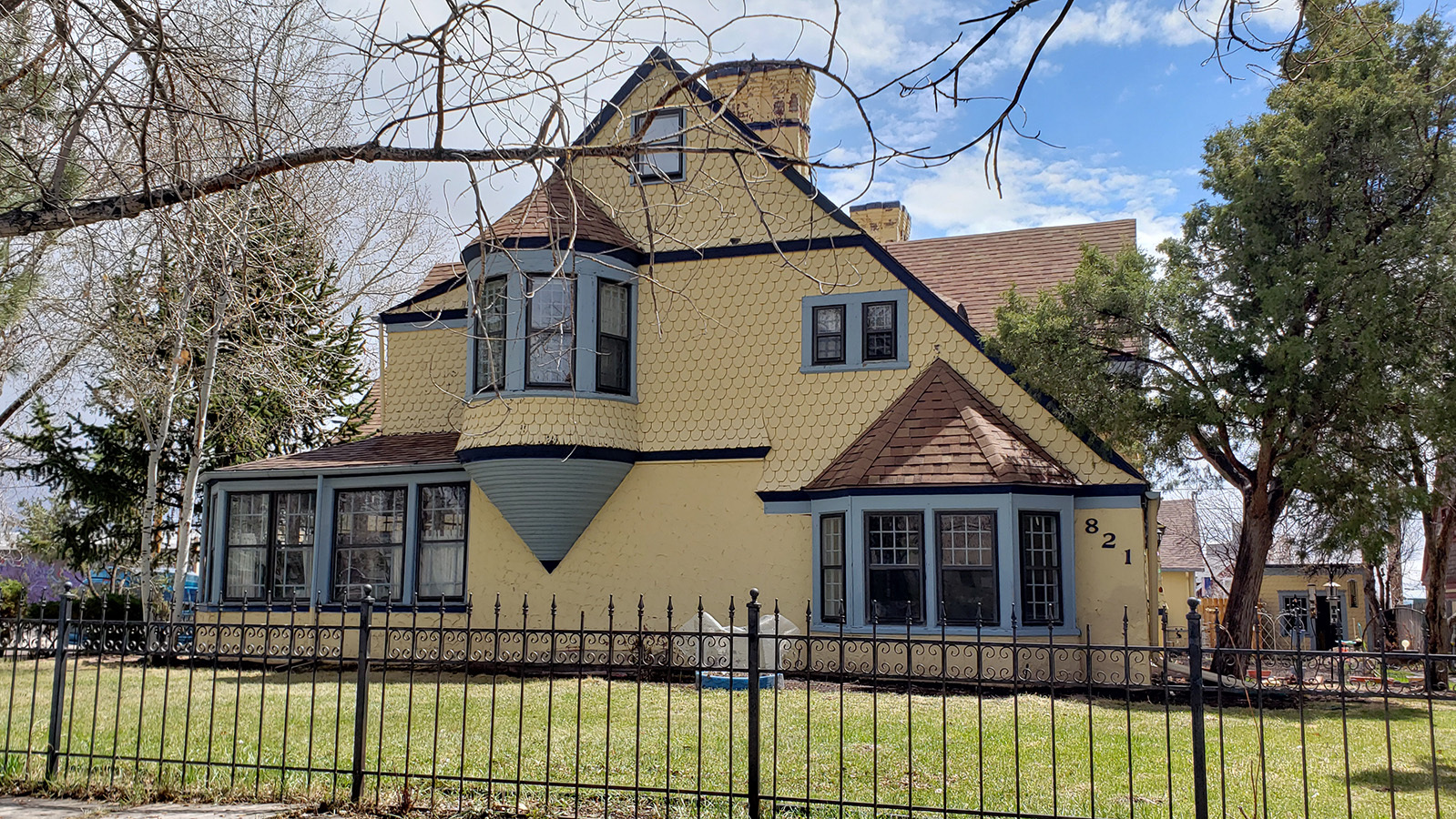 The exterior of the Sturgis House in Cheyenne features many architectural styles, including a turret and bay window.