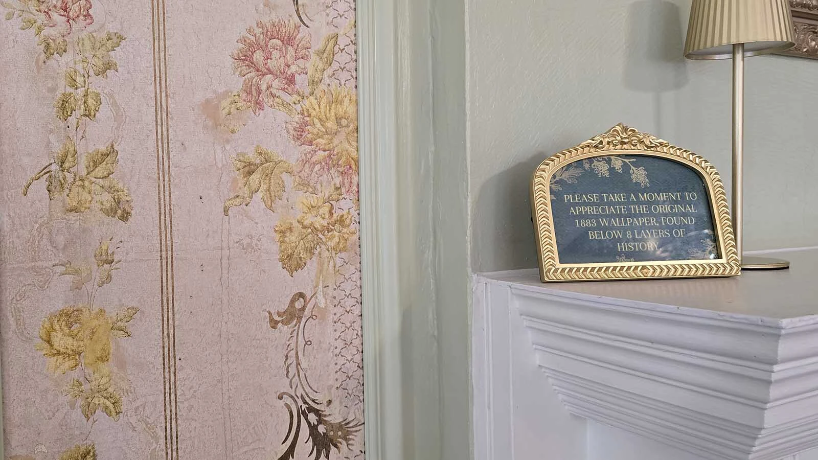 The strip of wallpaper, to the left of the fireplace in the Tranquillity room, has been preserved. It is the first layer of wallpaper at the home, and was hidden below seven other layers.