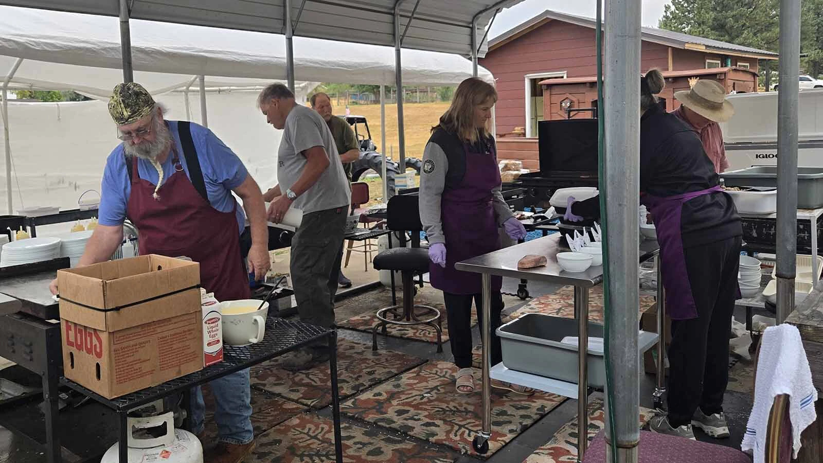 Cooks in the outdoor kitchen fire up their griddles.