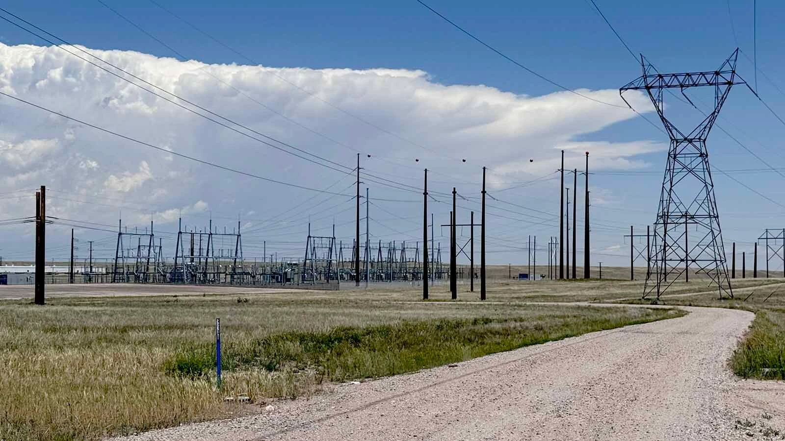 Power transmission lines and a Black Hills Energy substation south of Cheyenne along U.S. Highway 85 near the Project Jade AI data center development.
