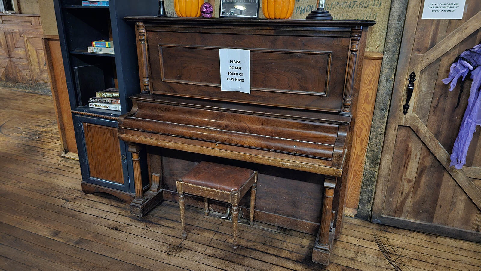 This piano is always closed. But every now and then, patrons and bar employees have heard it plink, despite being closed.