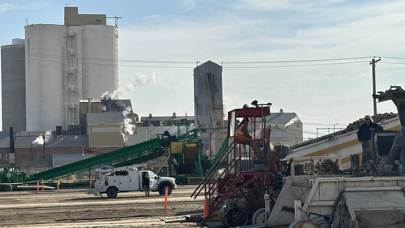 The conveyor belts are used to unload sugar beets from the trucks and remove the excess dirt from each load. They are also used to move the sugar beets into the factory for processing into sugar.