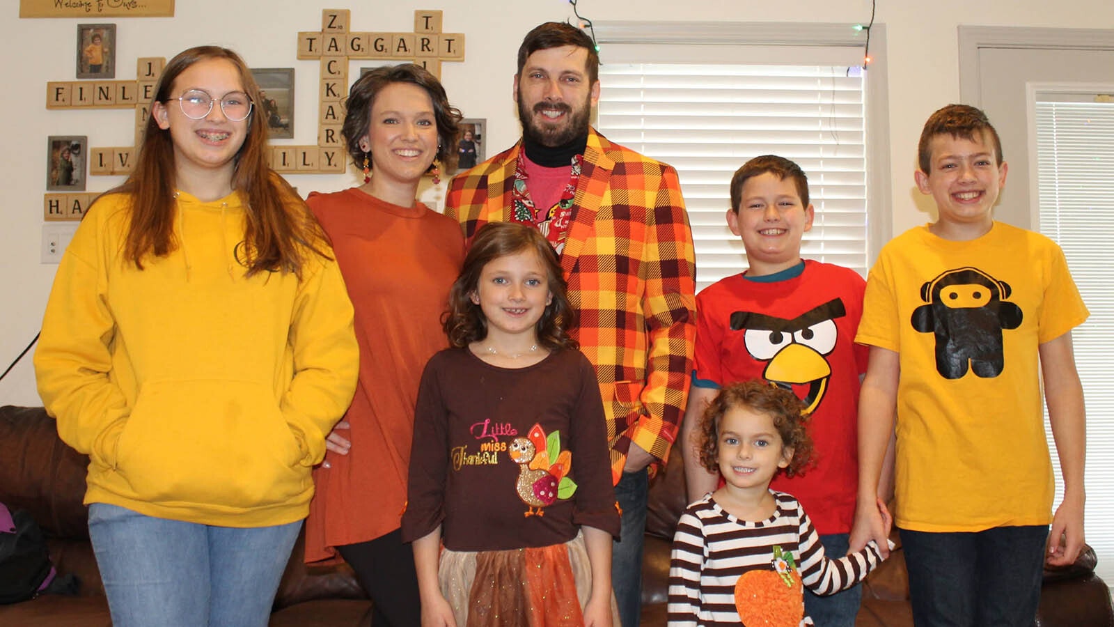 Zack Ivie poses with his family showing off the colors for the fall and Thanksgiving season.