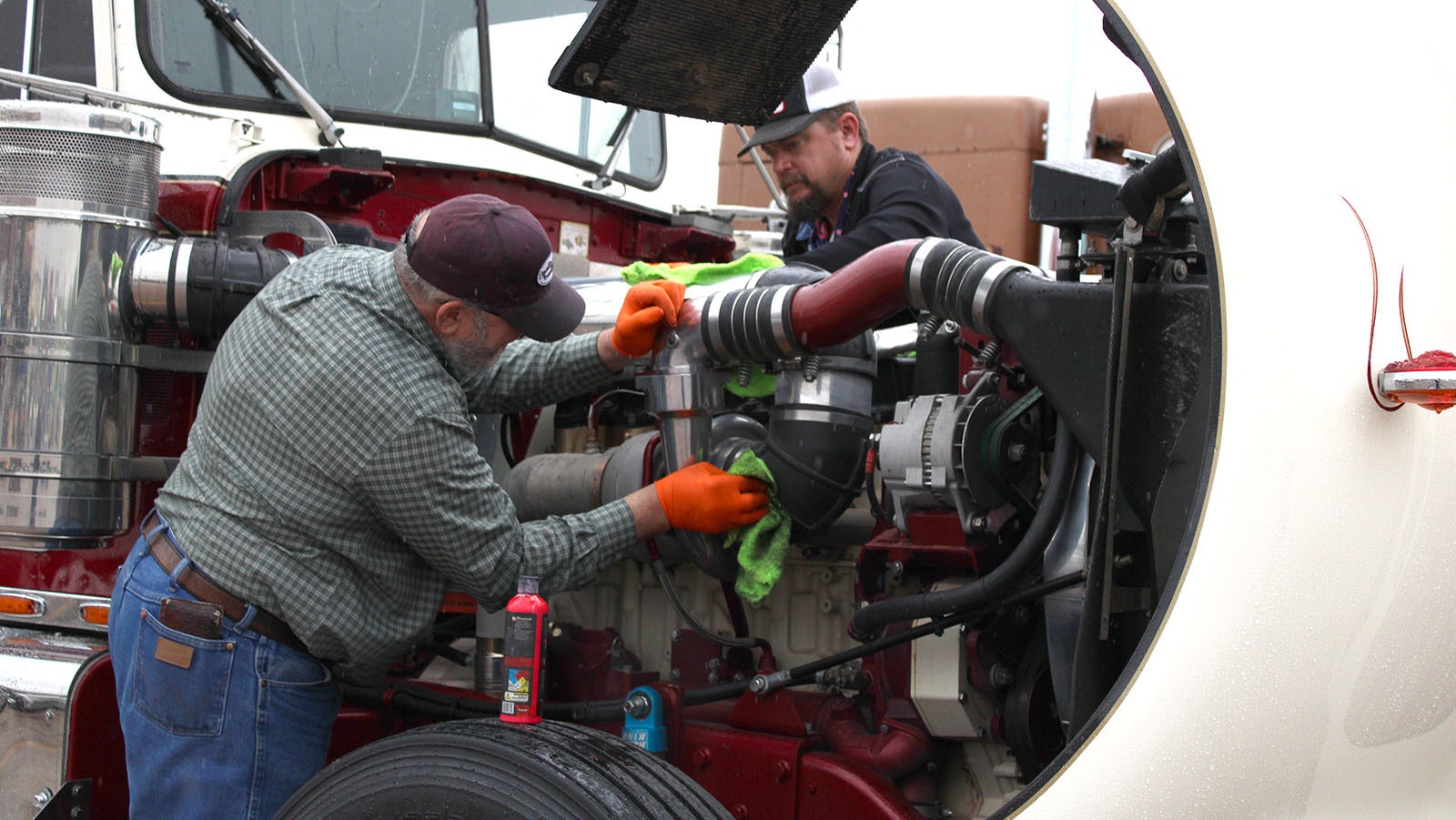 Clyde Green cleans up the engine of his truck before judging at the Shell Rotella Super Rigs Truck Show in Gillette on Saturday.