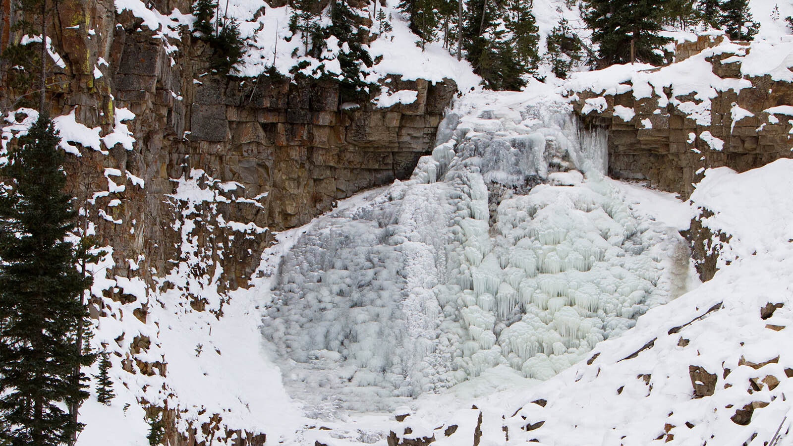 Rustic Falls in Yellowstone National Park is frozen over during a cold winter in this file photo.