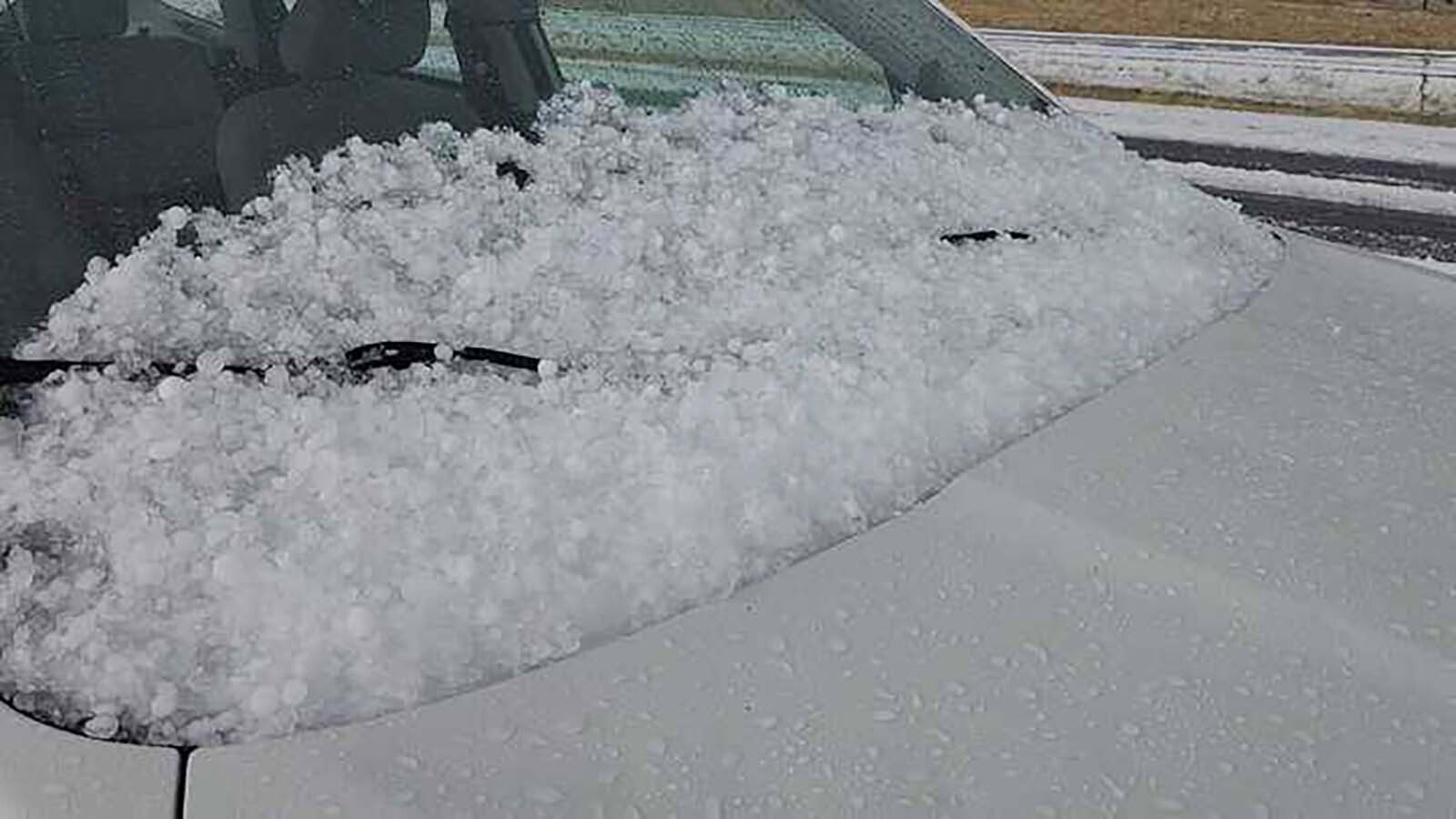 Hail blankets the ground and vehicles like a snowstorm Thursday in eastern Wyoming. A supercell thunderstorm brought volatile weather, including hail, which was reported to be softball-sized in some areas.